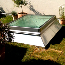 Square glass element on flat roof